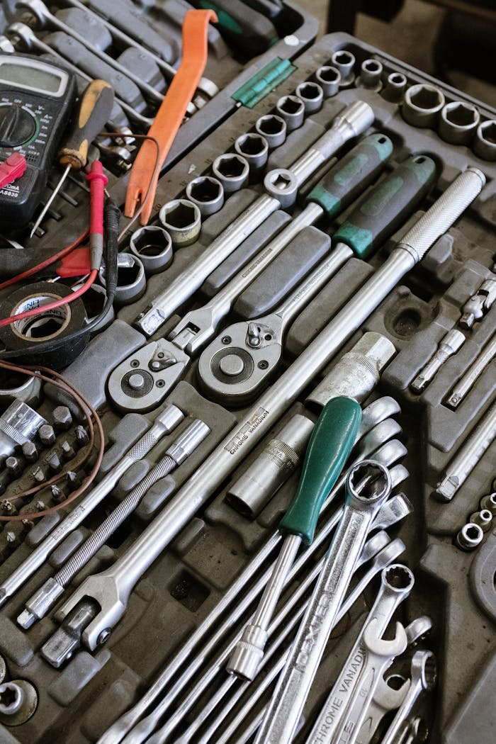 Services Detailed photo of various mechanic tools organized in a workshop setting. Perfect for repair themes.